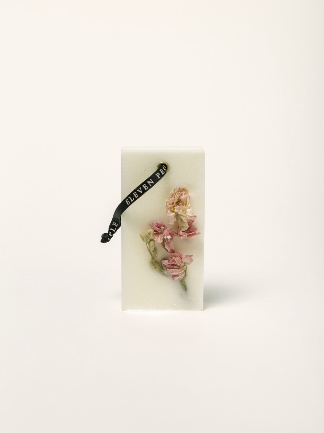 scented wax bar on white background