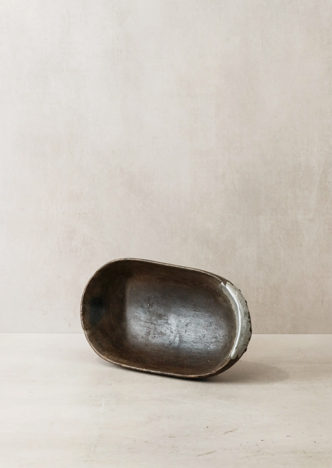 Black ceramic bowl on a beige background