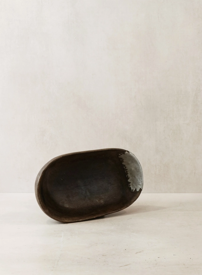 Black ceramic bowl on a light beige background