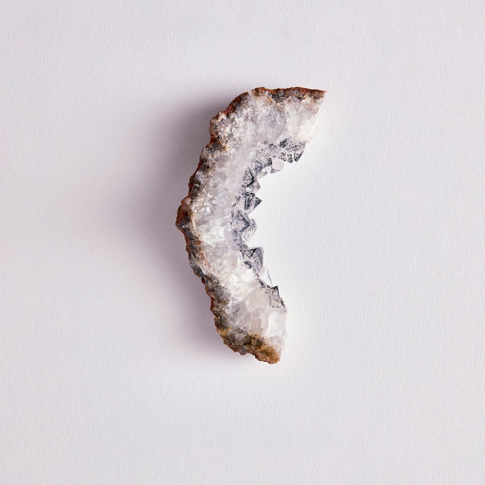 Geode crystal on a light gray background