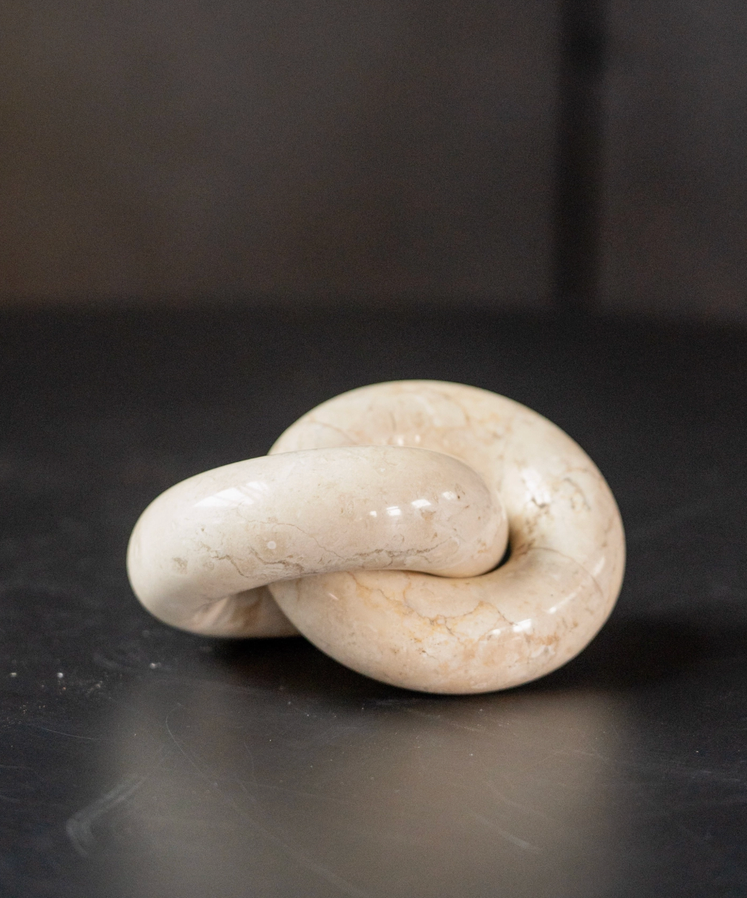 White stone knot on a dark surface