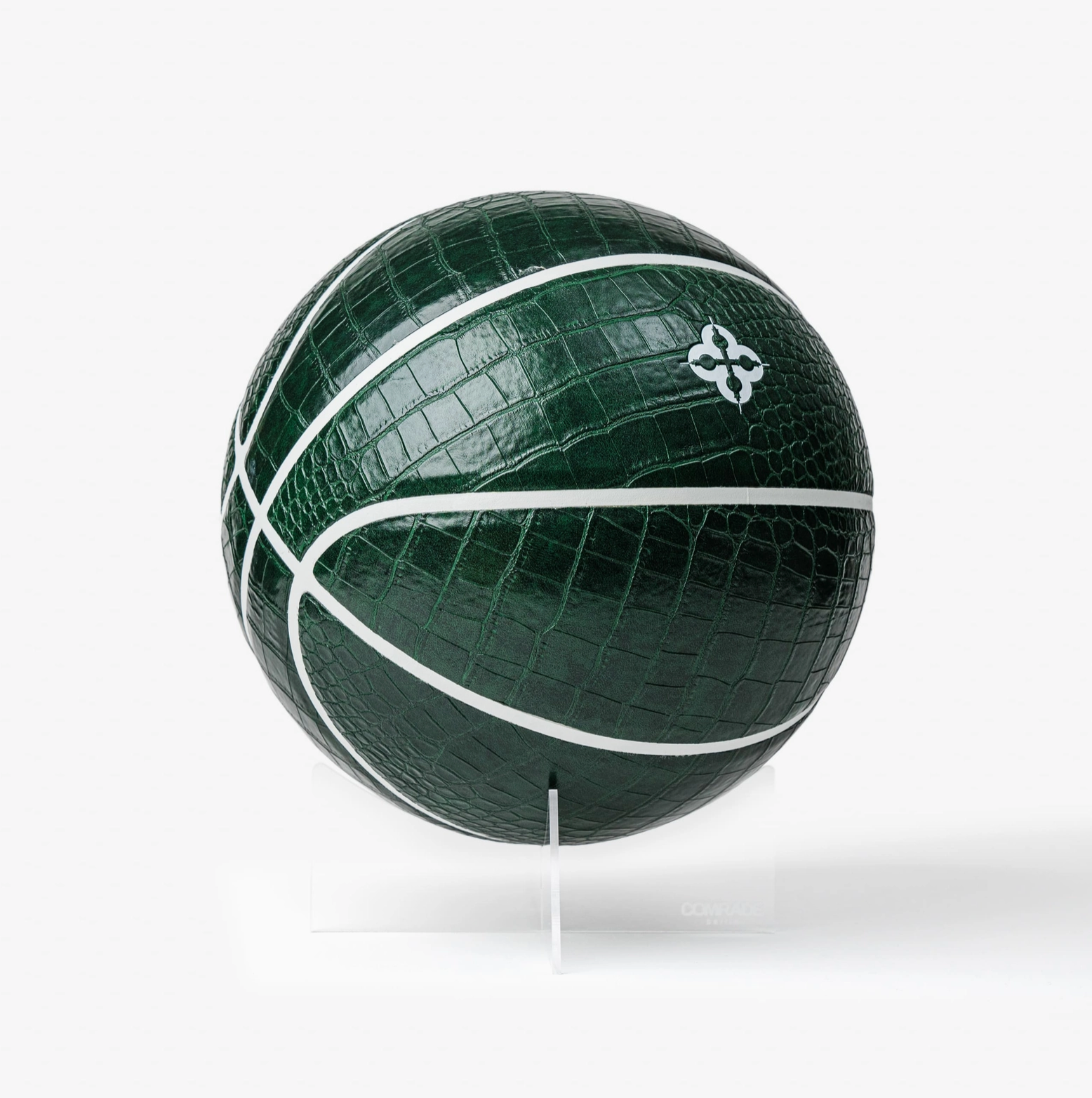 Green basketball with white stitching on a white background