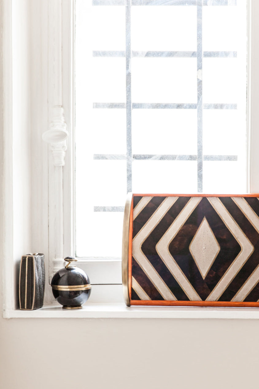 Decorative wall art with geometric pattern on a white wall