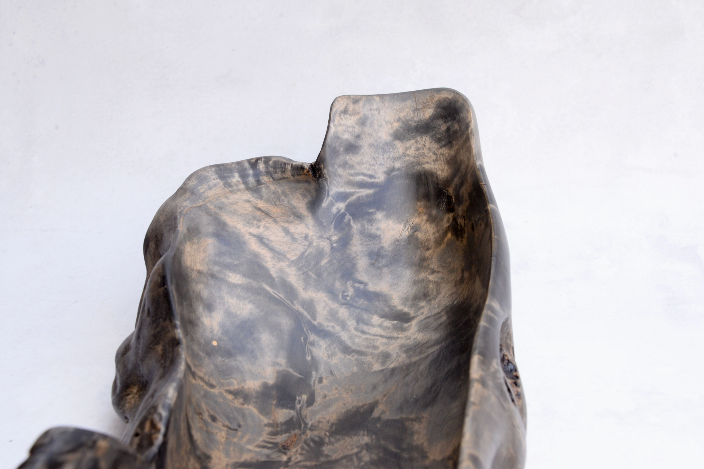 Decorative stone sculpture of a bear on a white background