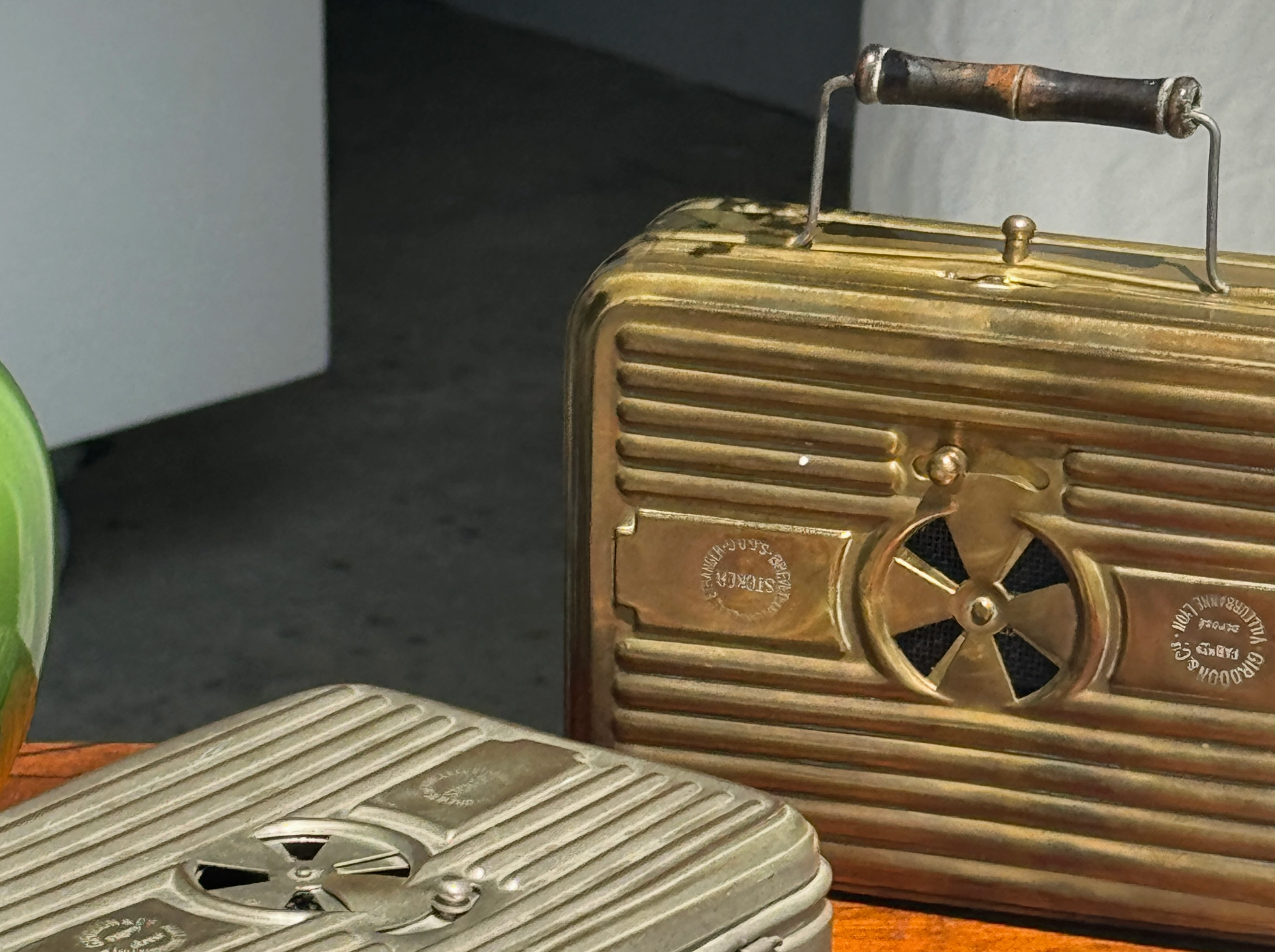 Vintage radio with a prominent brand logo on a wooden surface.