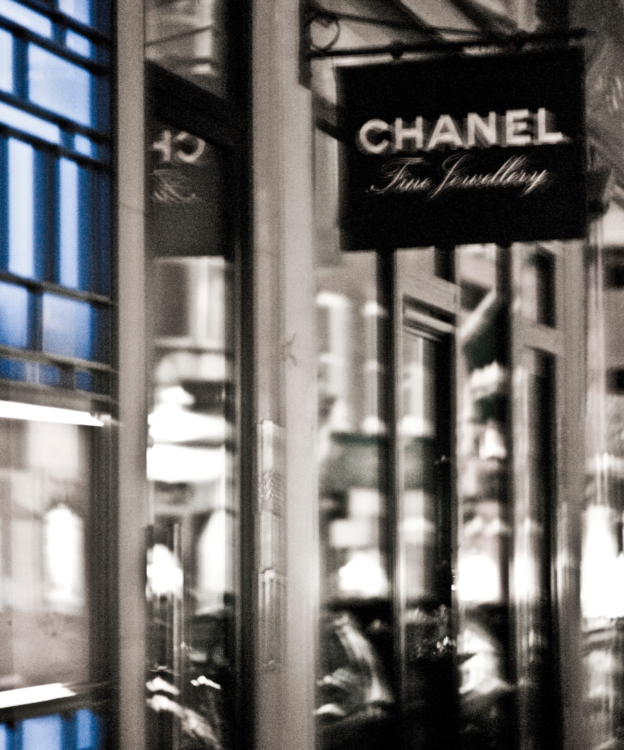 Chanel jewelry store sign in a city street setting