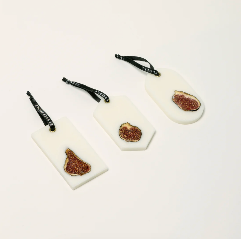 Three decorative items with wax bar centers on a white background