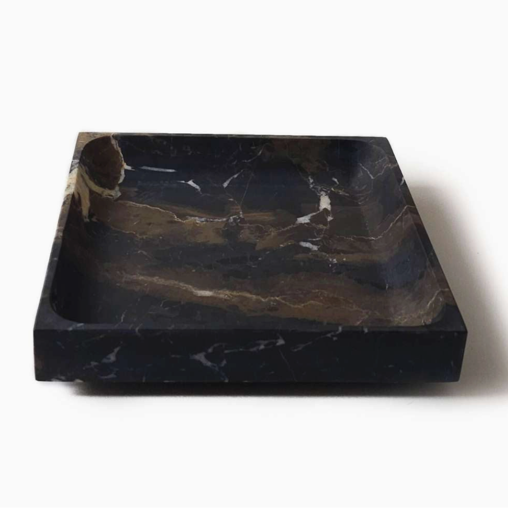 Black marble tray on a white background