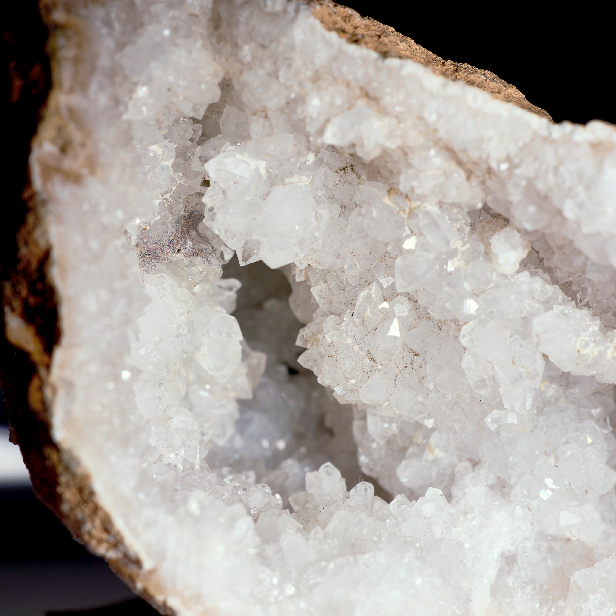 Close-up of a crystal formation with a dark background