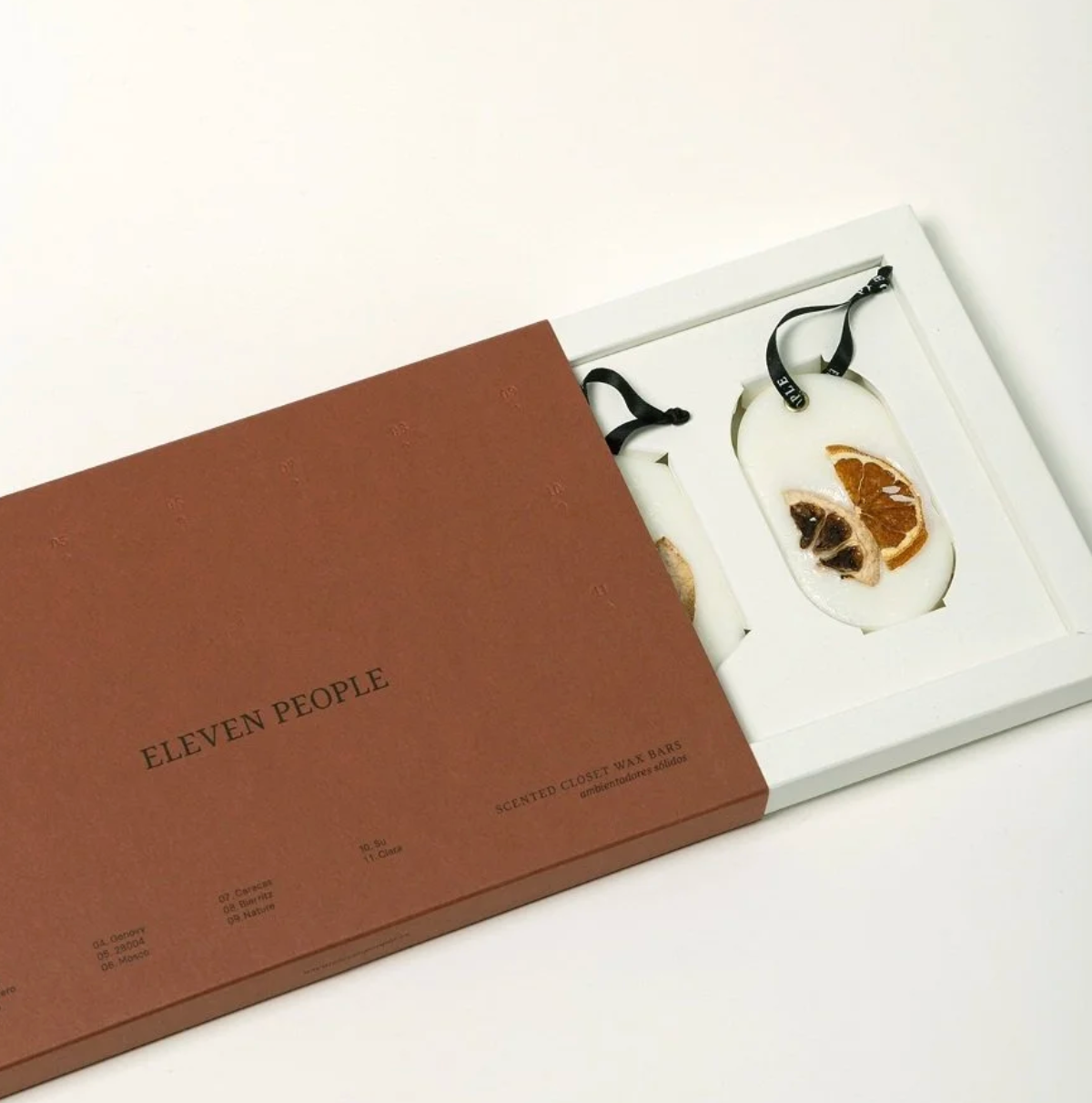 Necklace with a brown box labeled 'Eleven People' on a white background