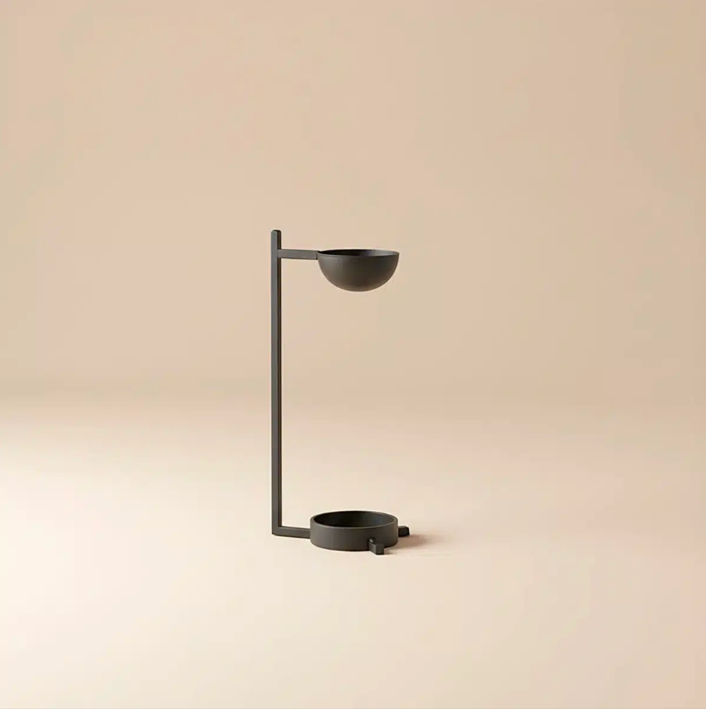 Black metal lamp with two bowls on a beige background