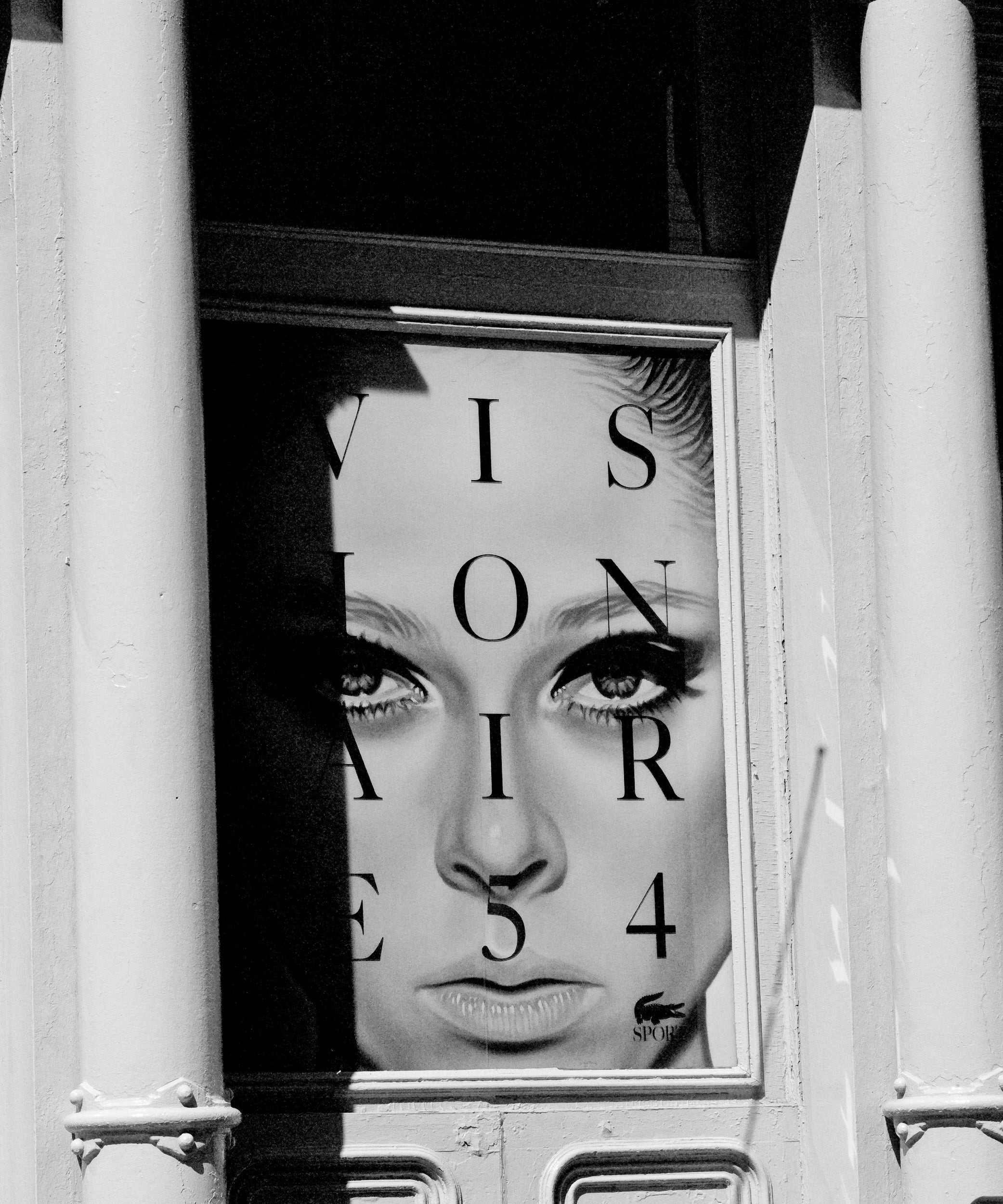 Black and white image with alphabet letters on womens face