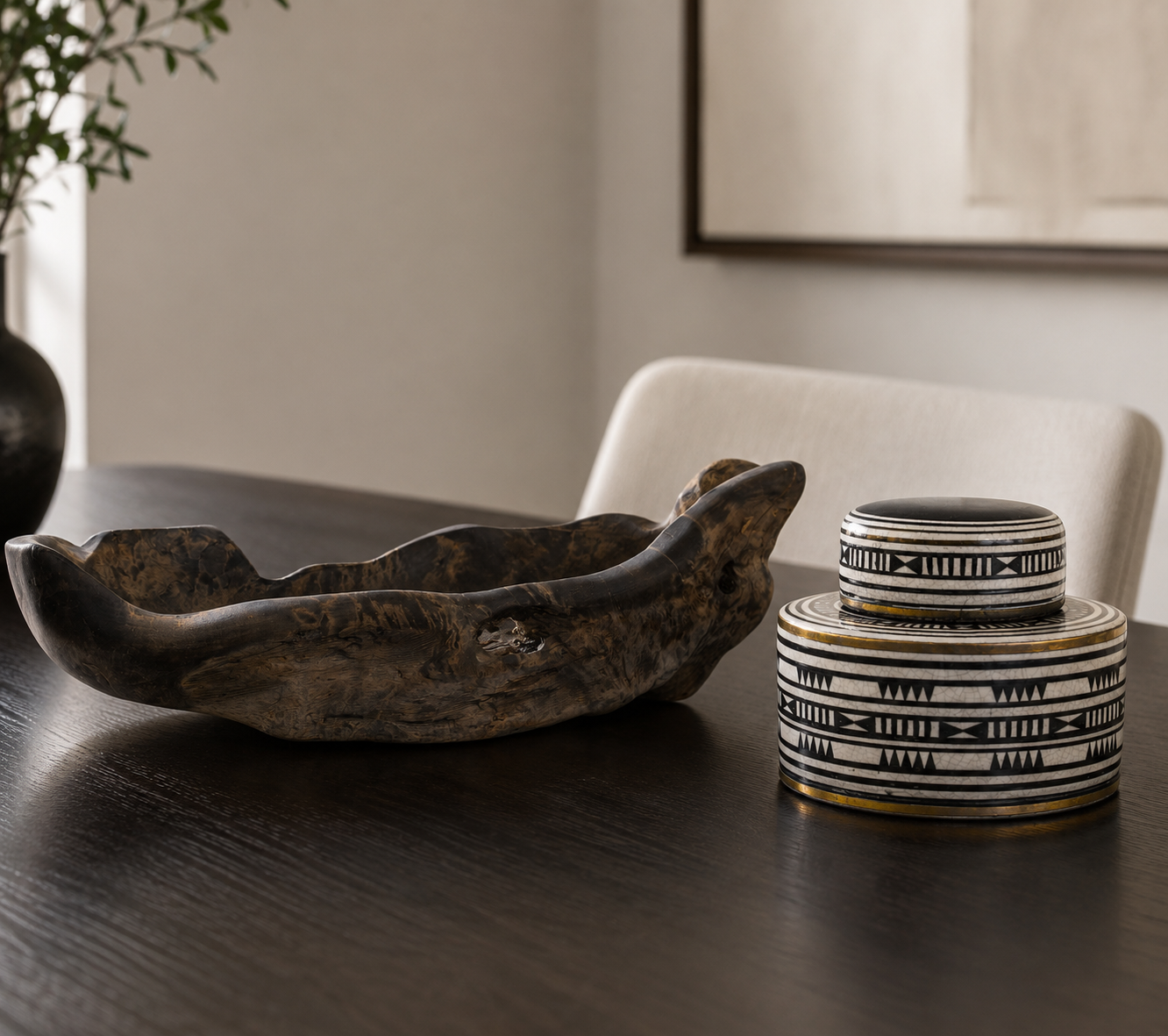 Decorative bowls on a dark wooden surface with a blurred background