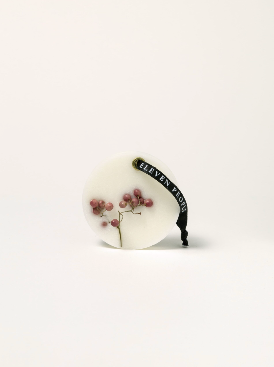 round scented wax bar on white background