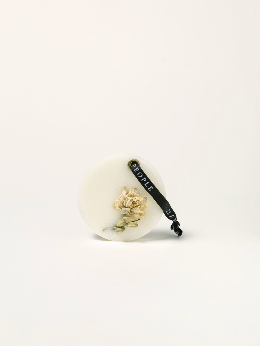 Small decorative item with coral-like structure and 'People' branding on a white background