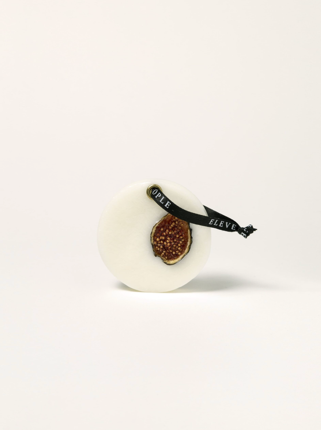 round scented wax bar on a white background