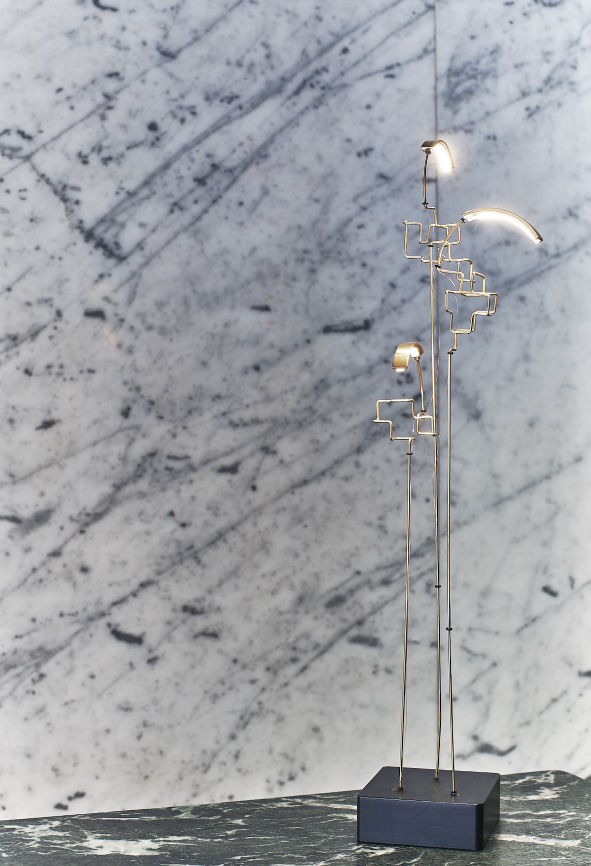 Modern floor lamp with geometric design on a marble background