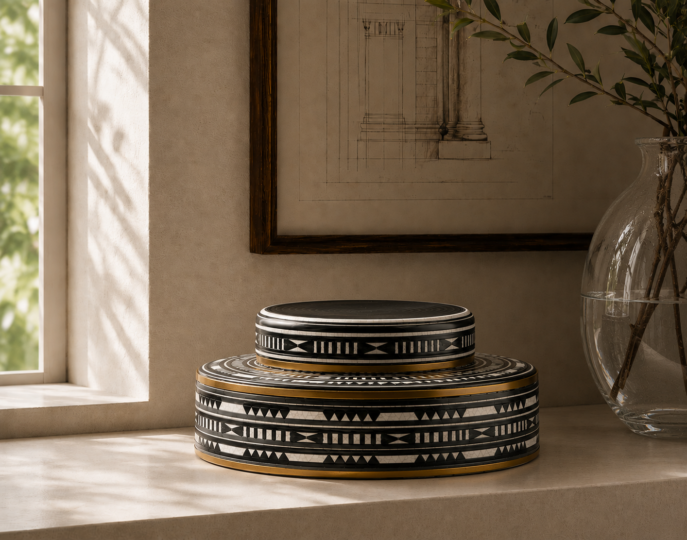 Extra large round decorative ginger jar with black, white, and gold geometric patterns, displayed on a windowsill in a warm, sunlit room.