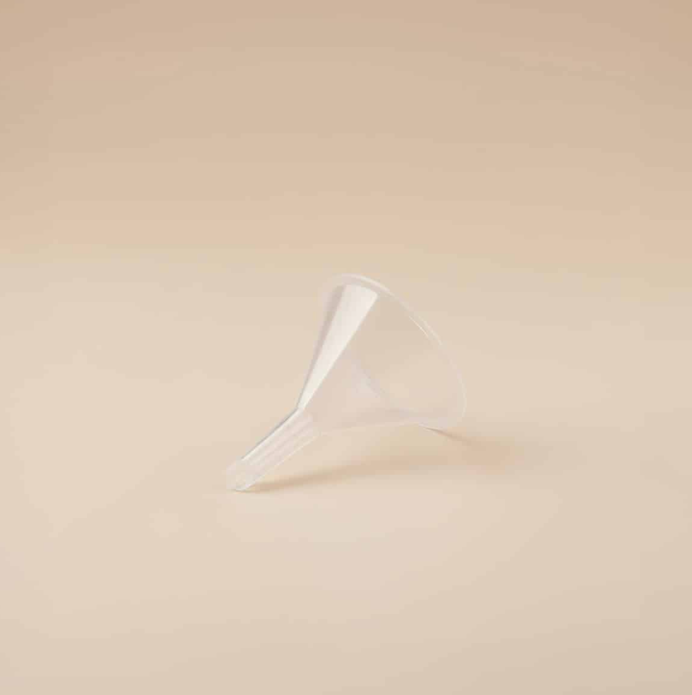 White plastic hanger on a beige background