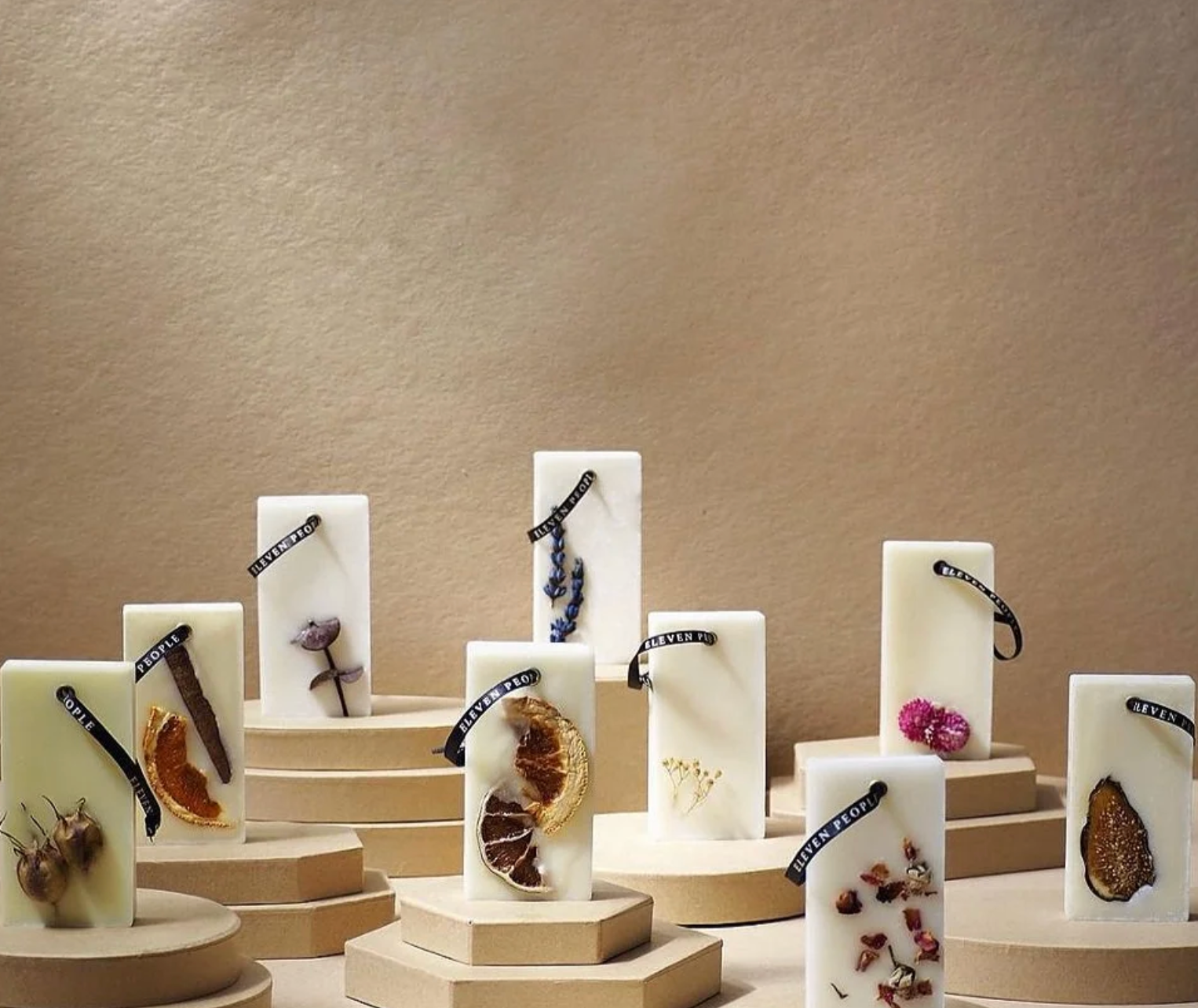 Jewelry display with various items on a neutral background