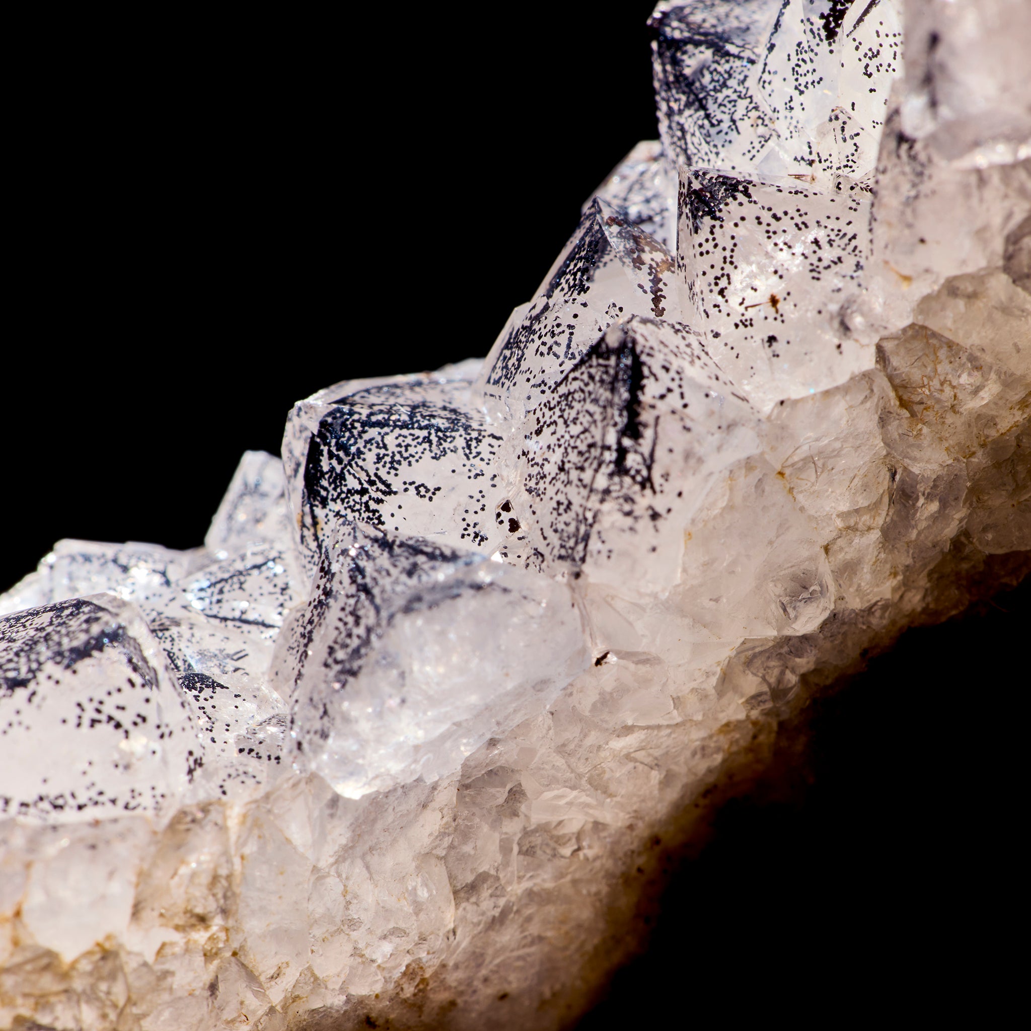 Close-up of crystal formations on a dark background