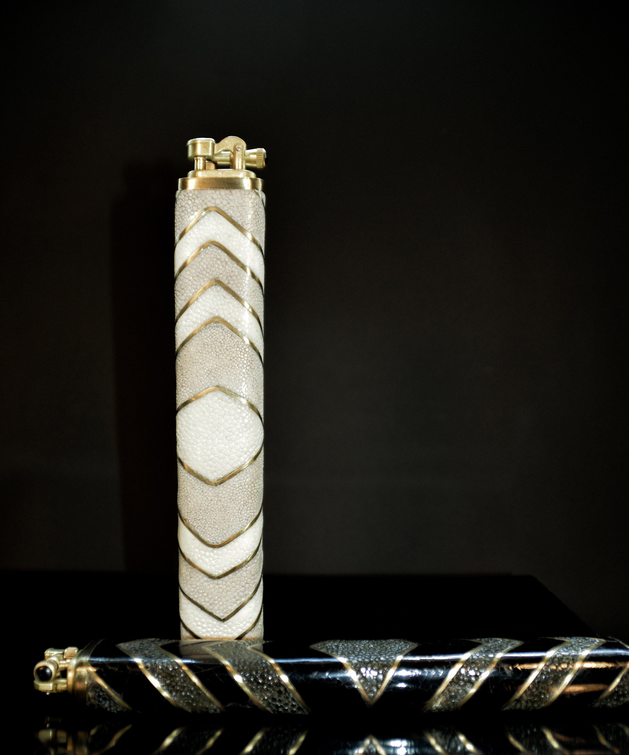 LIGHTER with geometric pattern on a dark background