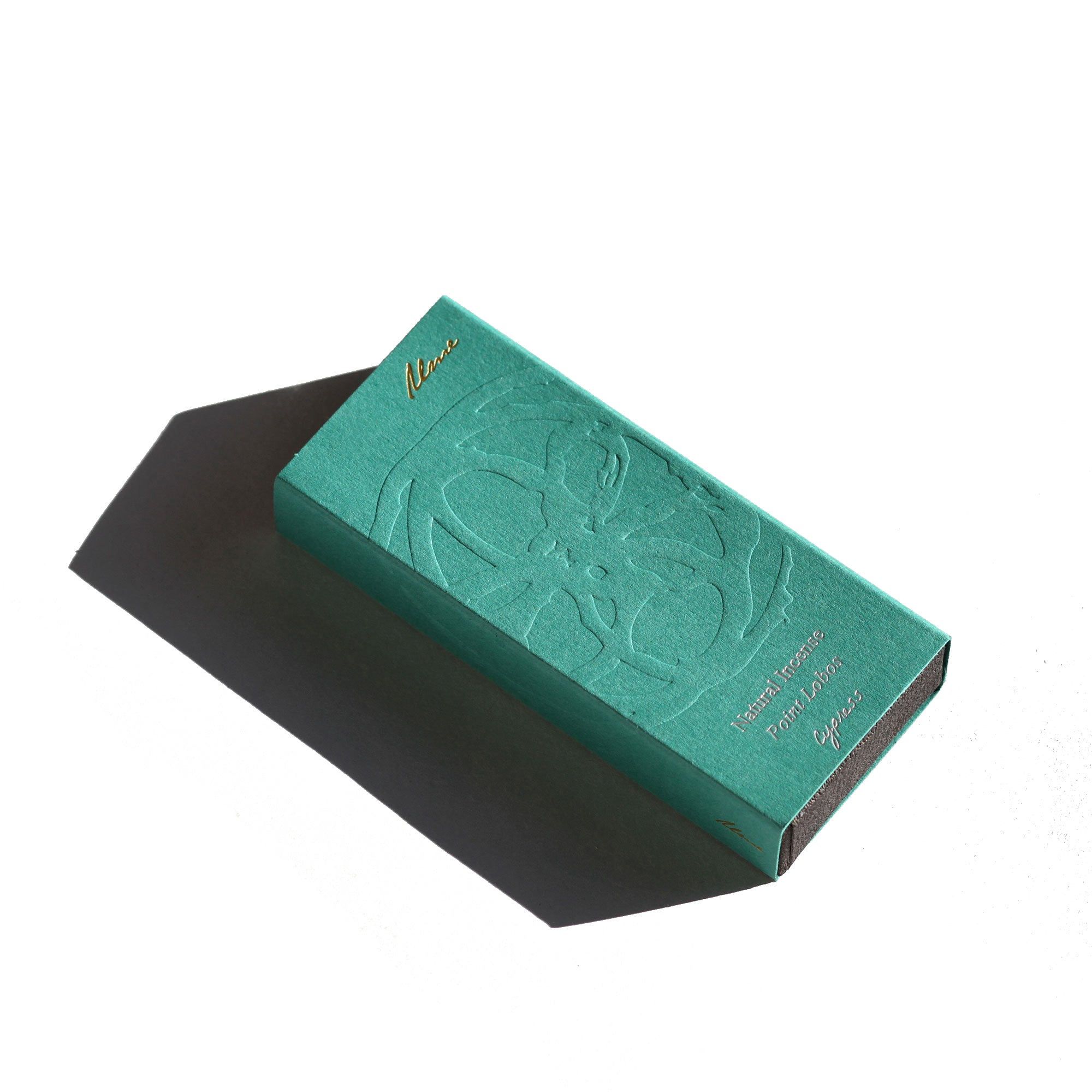 Green jewelry box with embossed design on a white background