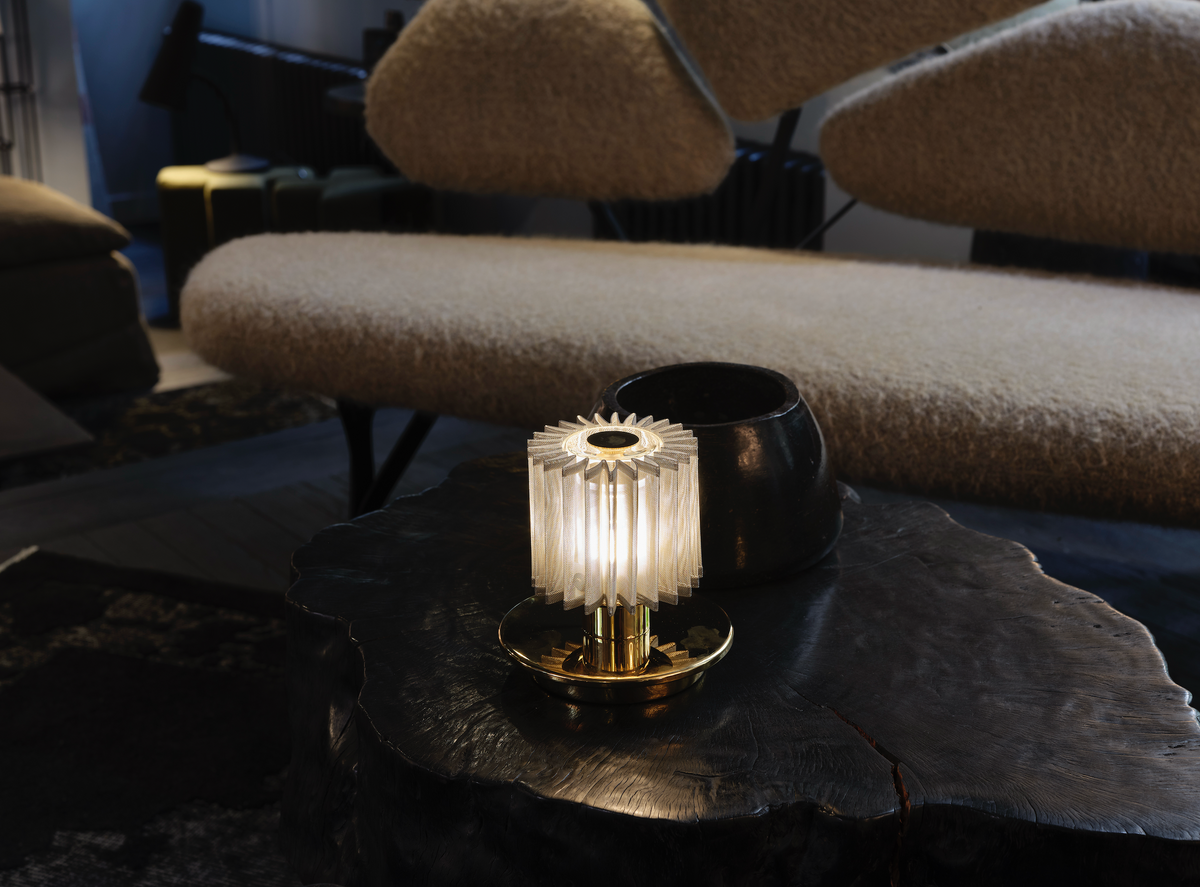 Decorative lamp on a dark surface with a blurred background