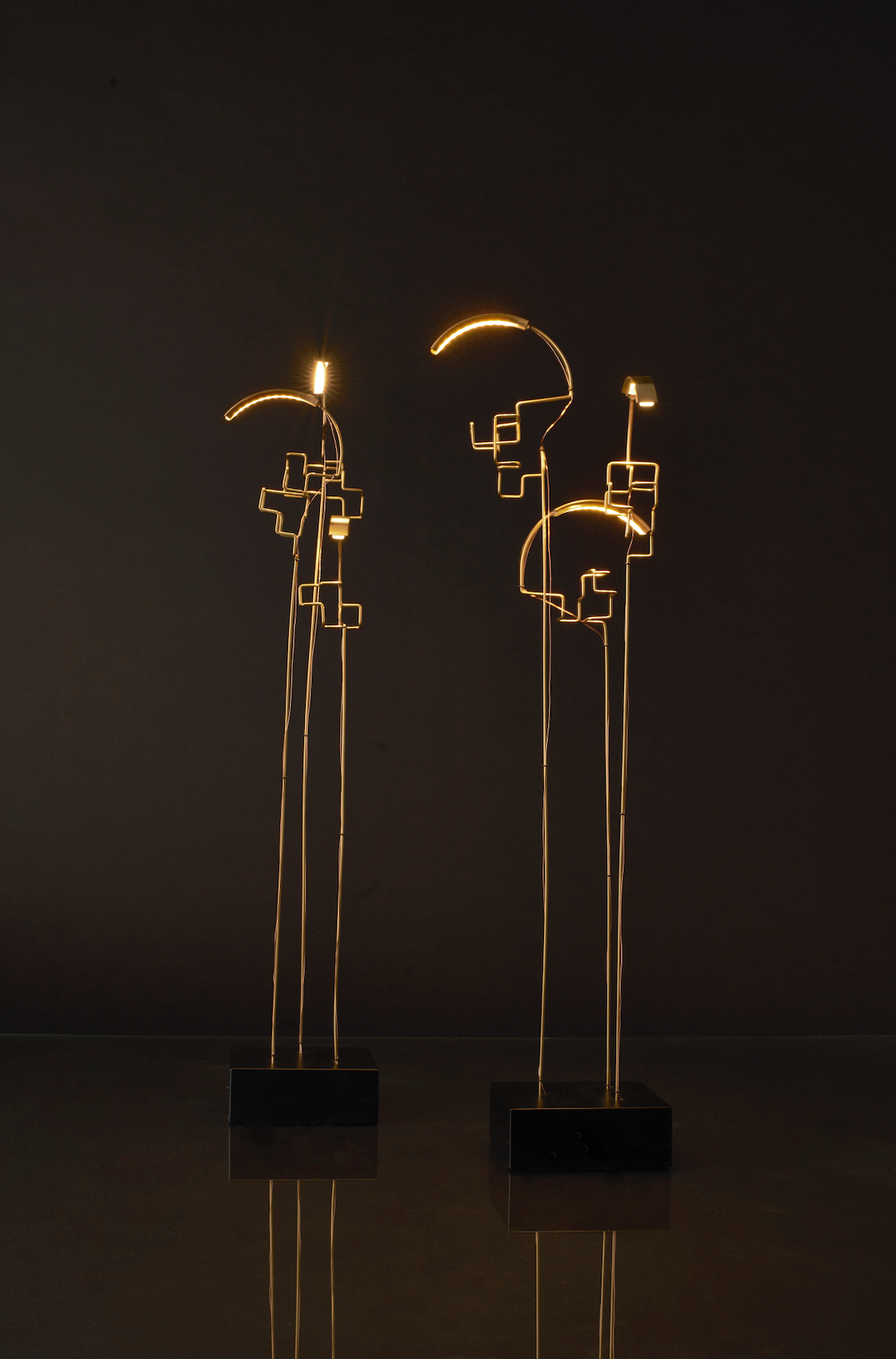 Modern abstract light fixtures on a dark background