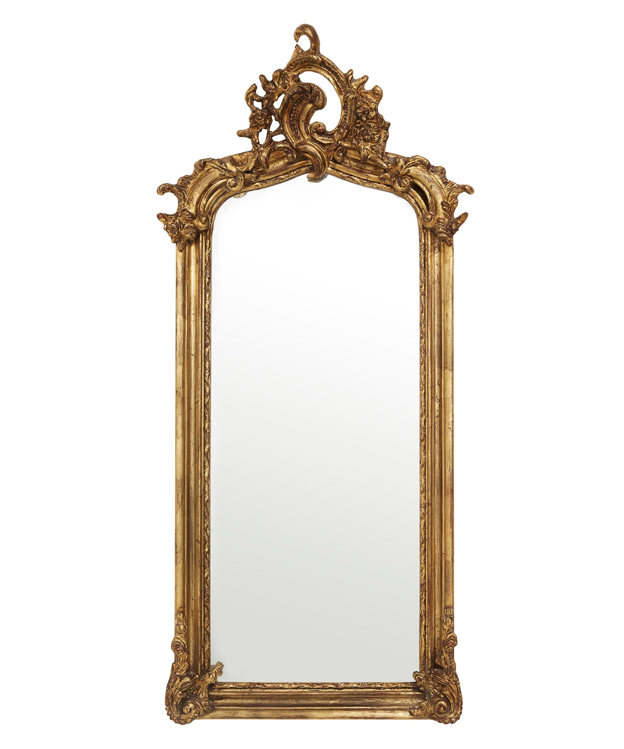 Decorative gold-framed mirror on a white background