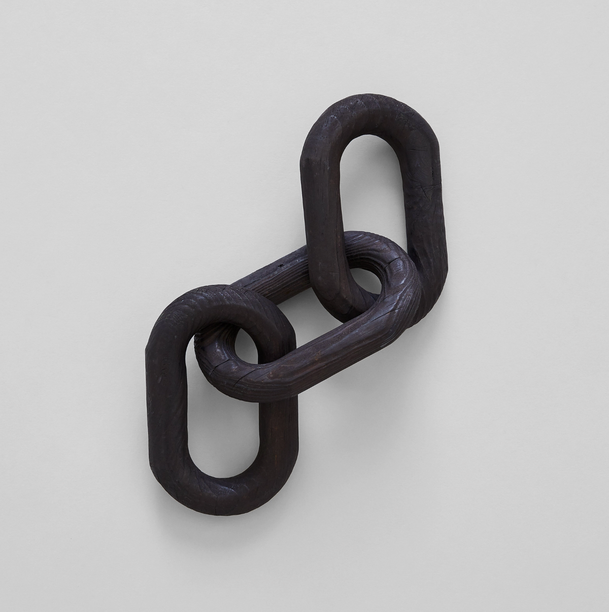 Black chain link on a light gray background