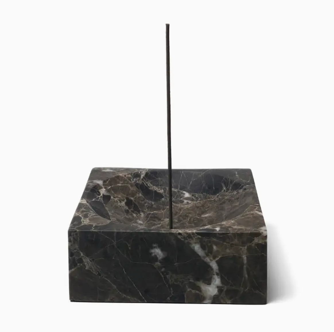 Black marble incense burner on a white background